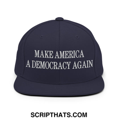 Navy blue snapback cap with white embroidered make america a democracy again text and flat bill brim design