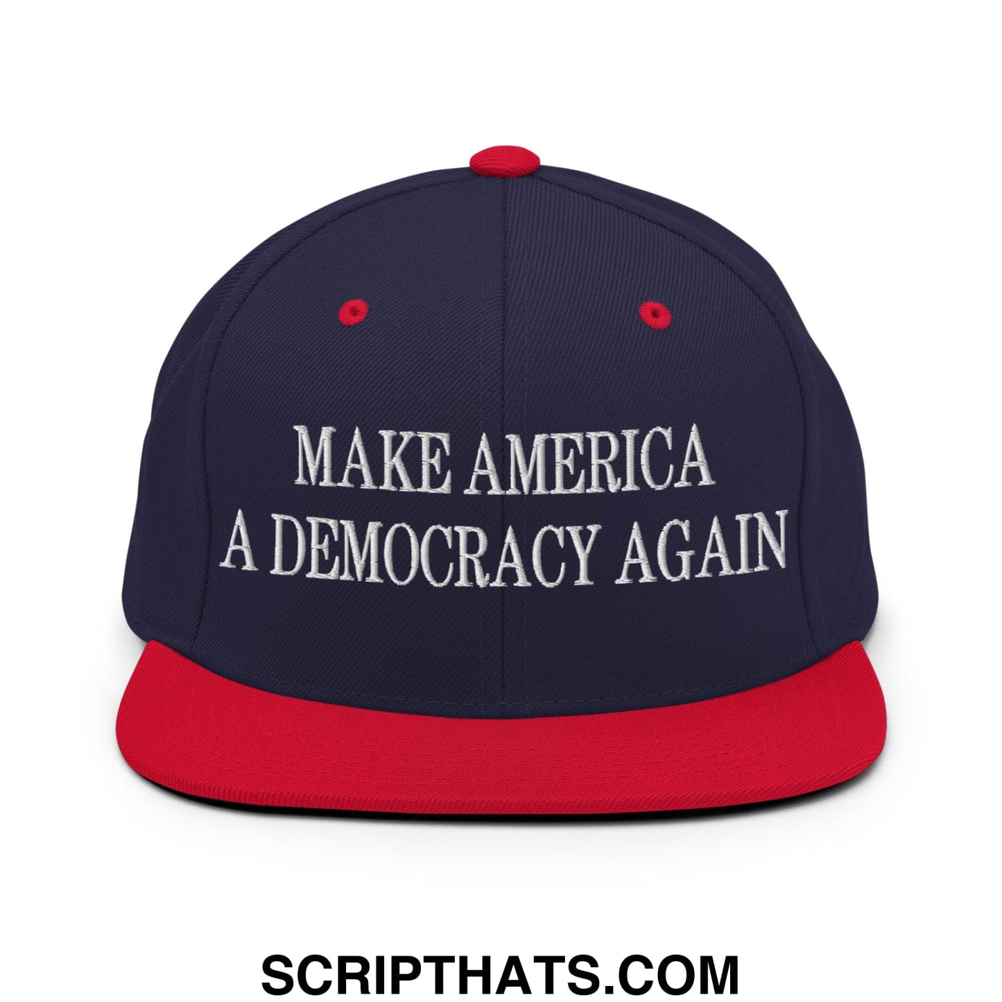 Navy blue and red snapback cap with white embroidered text make america a democracy again on flat bill brim