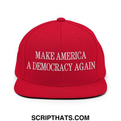 Red snapback cap with white embroidered text make america a democracy again and flat bill brim design