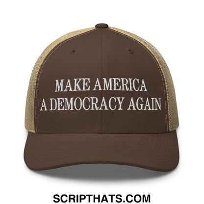 Brown and tan mesh trucker hat with white embroidered make america a democracy again text on front panel