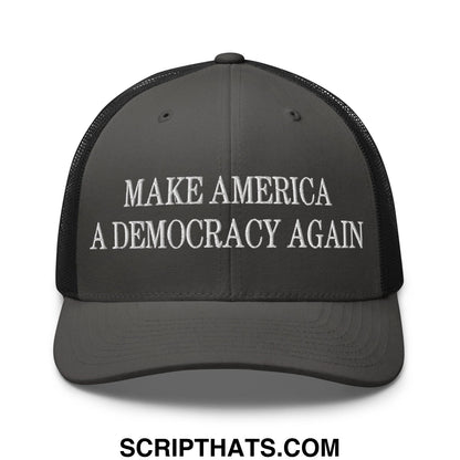 Dark gray mesh trucker hat with white embroidered text make america a democracy again on front panel