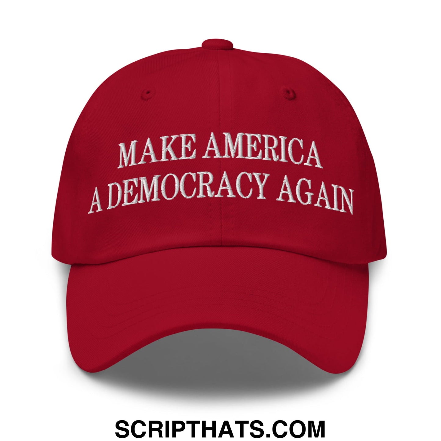 Red unstructured dad hat with white embroidered text make america a democracy again for casual wear