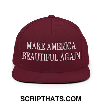 Maroon snapback hat with white embroidered make america beautiful again text and flat bill brim design