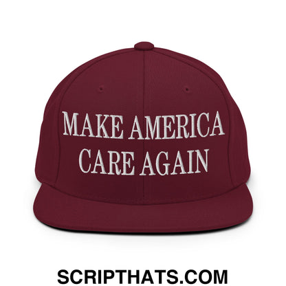 Maroon snapback hat with white embroidered make america care again text and flat bill brim design