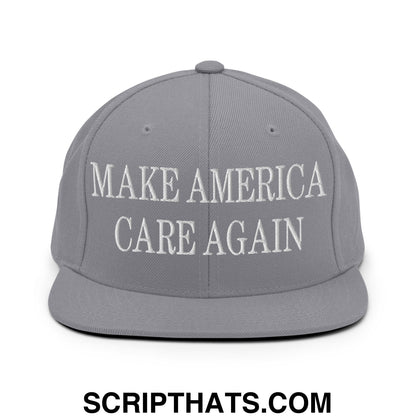 Gray snapback cap with white embroidered make america care again text and flat bill brim for casual wear