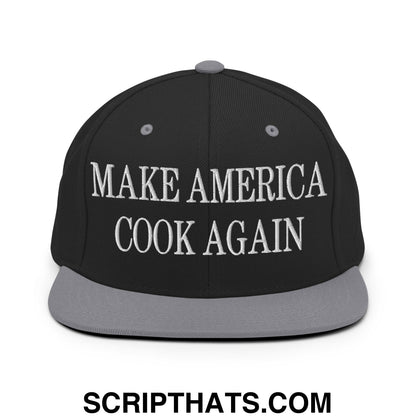 Black snapback cap with gray brim and white embroidered make america cook again text flat bill brim snapback hat