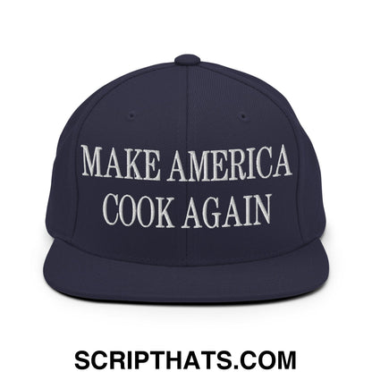 Navy blue flat bill snapback hat with white embroidered make America cook again text for casual wear