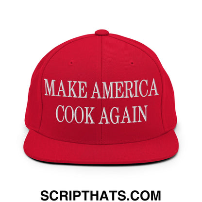 Red snapback cap with white embroidered text make america cook again and a flat bill brim design