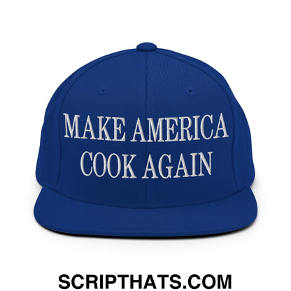 Royal blue snapback hat with white embroidered make america cook again text and flat bill brim design