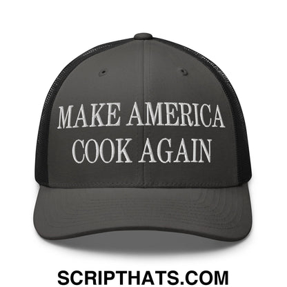 Dark gray mesh trucker hat with white embroidered make america cook again text across the front panel
