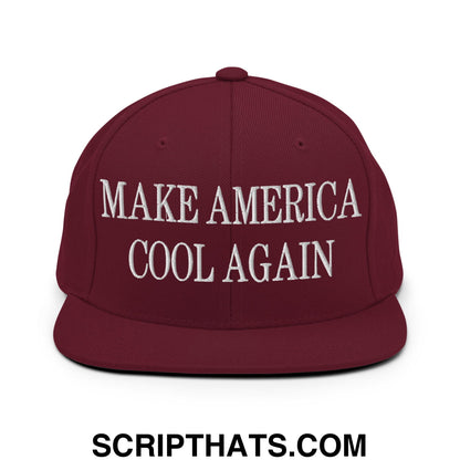 Maroon snapback hat with white embroidered make america cool again text and flat bill brim design