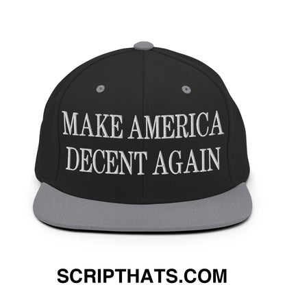 Black snapback cap with gray brim and white embroidered make america decent again text on front flat bill hat