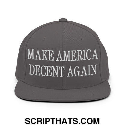 Gray snapback hat with white embroidered make america decent again text and a flat bill brim design