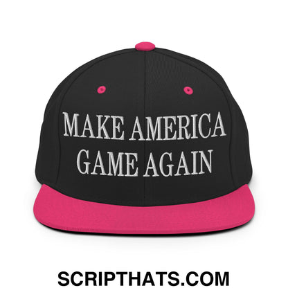 Black snapback cap with vibrant pink flat bill brim and white embroidered text make America game again