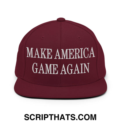 Maroon snapback hat with white embroidered make america game again text and flat bill brim design