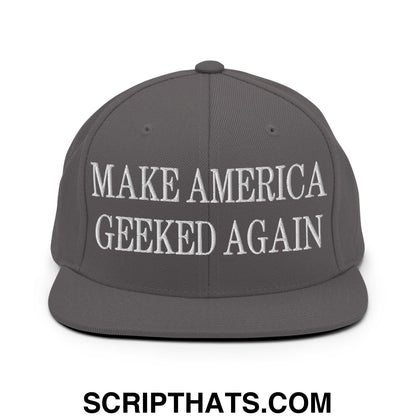 Gray flat bill brim snapback hat with white embroidered text reading make america geeked again for casual wear