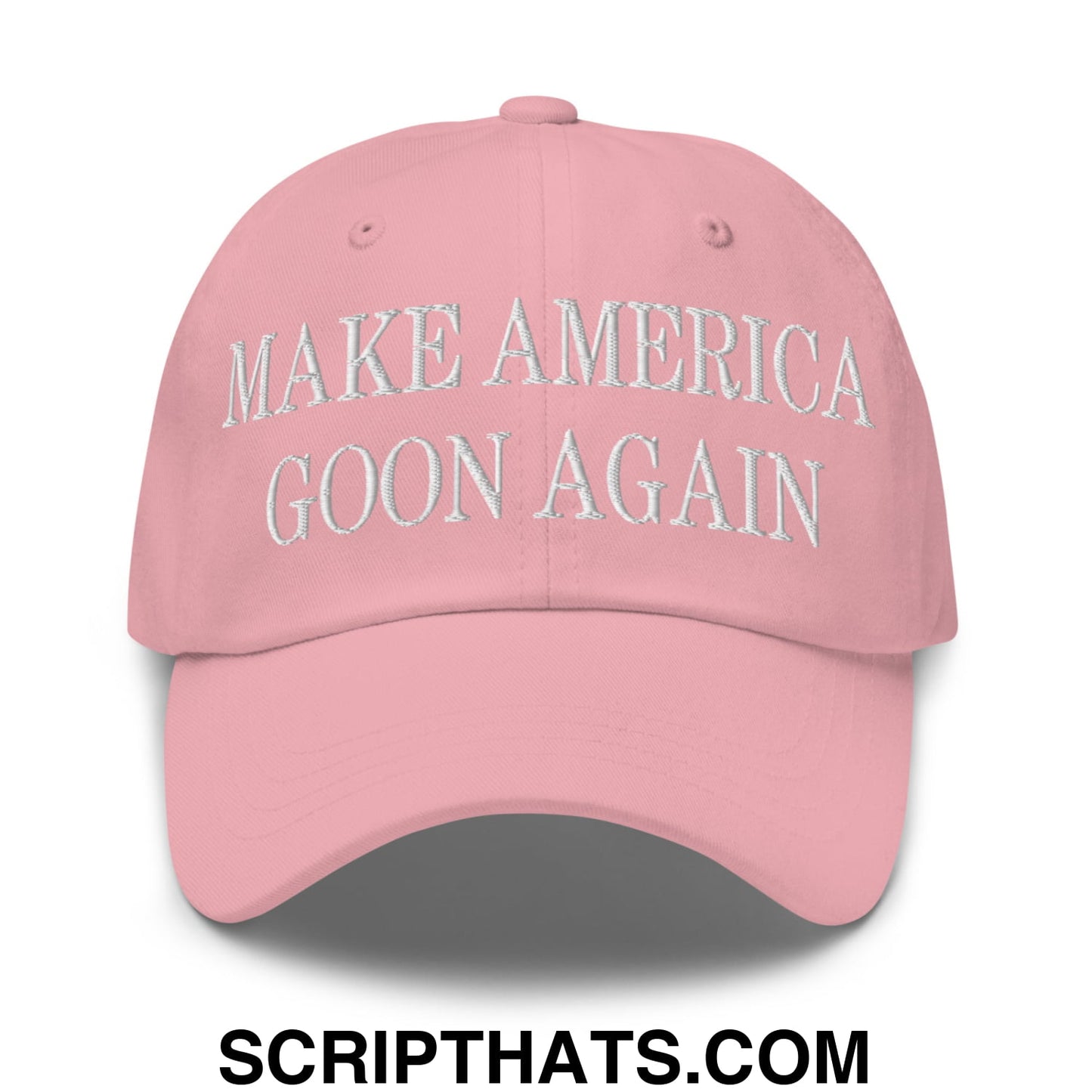 A pink unstructured dad hat with white embroidered text make america goon again and adjustable fit
