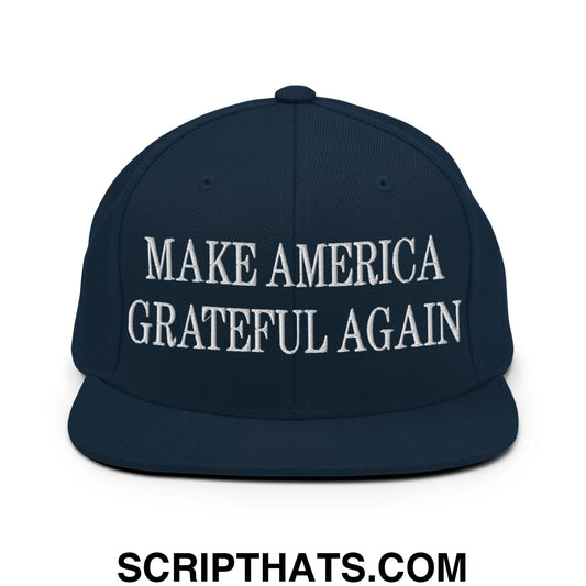 Navy blue snapback hat with white embroidered make america grateful again text and flat bill brim design