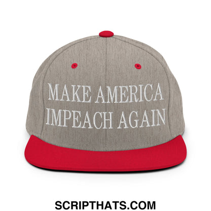 Gray snapback cap with red brim and button featuring white embroidered text make america impeach again