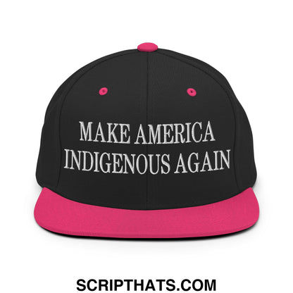 Black snapback cap with vibrant pink brim and button featuring white embroidered text make america indigenous again