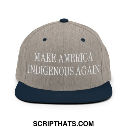 Gray and navy blue snapback hat with white embroidered make america indigenous again text on flat bill brim