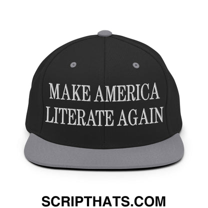 Black snapback cap with gray brim and white embroidered make america literate again text flat bill brim design