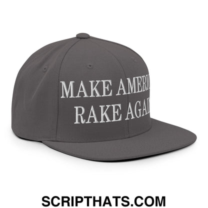 Gray snapback cap with white embroidered text make america rake again featuring a flat bill brim design