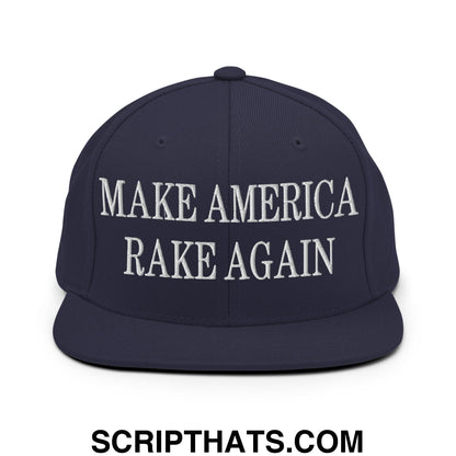Navy blue snapback hat with white embroidered make america rake again text and flat bill brim design