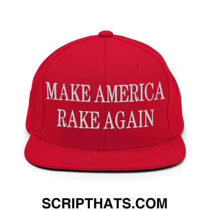Red snapback cap with white embroidered make america rake again text and flat bill brim for casual wear