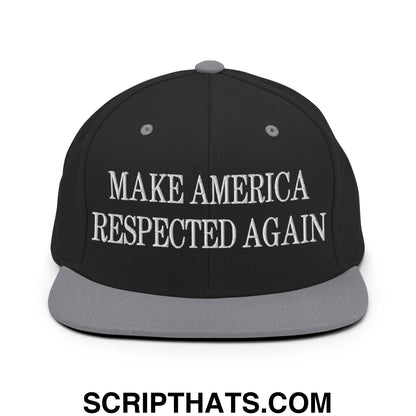 Black snapback cap with gray brim and white embroidered text make america respected again on front panel