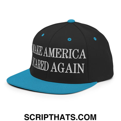 Black snapback cap with teal brim and button featuring white embroidered make america scared again text