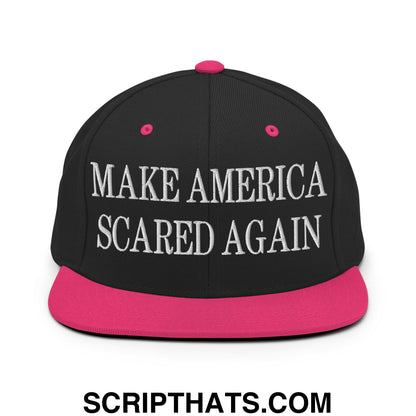 Black snapback cap with vibrant pink brim and button featuring white embroidered text make america scared again