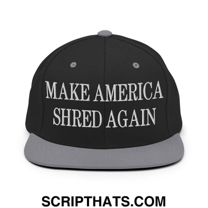 Black snapback cap with gray brim and white embroidered text reading make america shred again flat bill brim hat