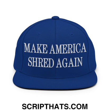 Royal blue snapback cap with white embroidered make america shred again text and flat bill brim design