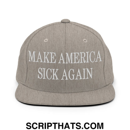 Gray snapback hat with white embroidered make america sick again text and a flat bill brim design