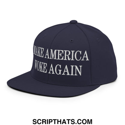 Navy blue snapback hat with white embroidered make America woke again text and flat bill brim design