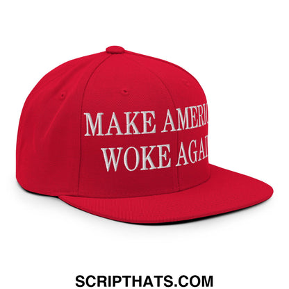 Red snapback cap with white embroidered make america woke again text and a flat bill brim design