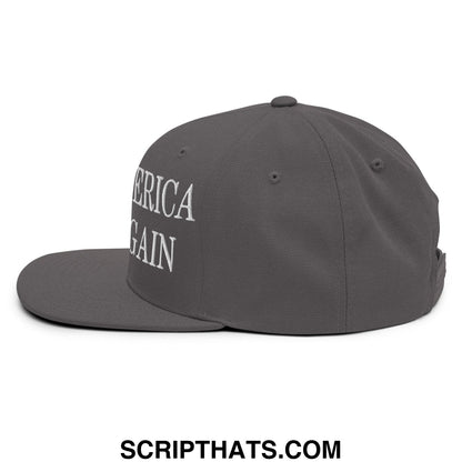 Dark gray snapback cap with america again embroidered in white script featuring a flat bill brim design