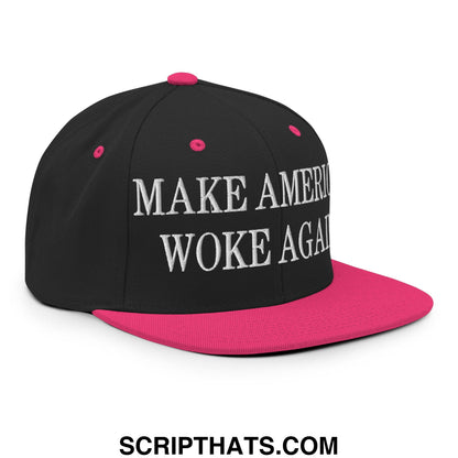 Black snapback cap with vibrant pink brim and button featuring white embroidered make america woke again text