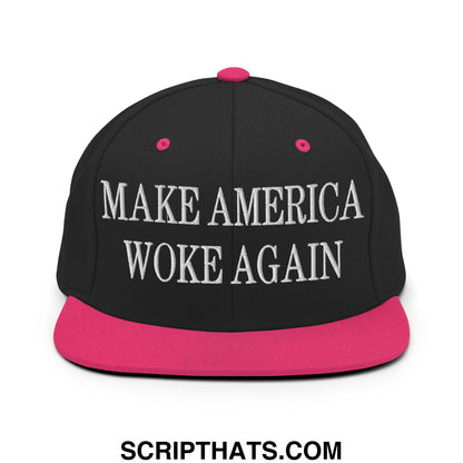 Black snapback hat with vibrant pink brim and button featuring white embroidered text make America woke again