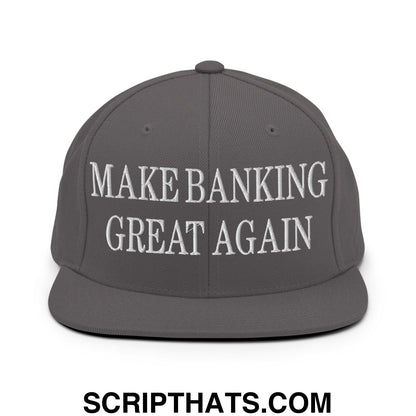 A dark gray snapback hat with a flat bill brim featuring white embroidered make banking great again text