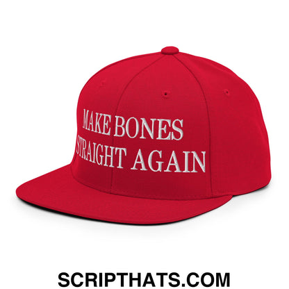 Red snapback hat with flat bill brim and white embroidered make bones straight again text on the front