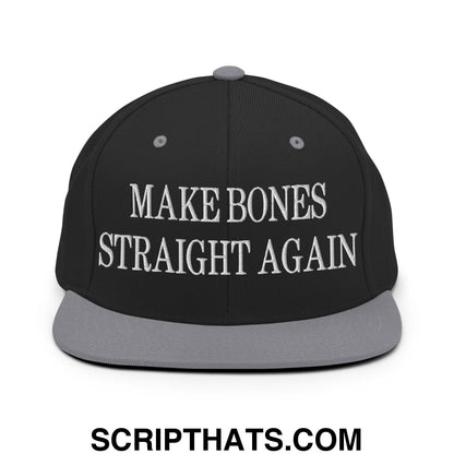 Black snapback cap with gray brim and white embroidered make bones straight again text on front panel