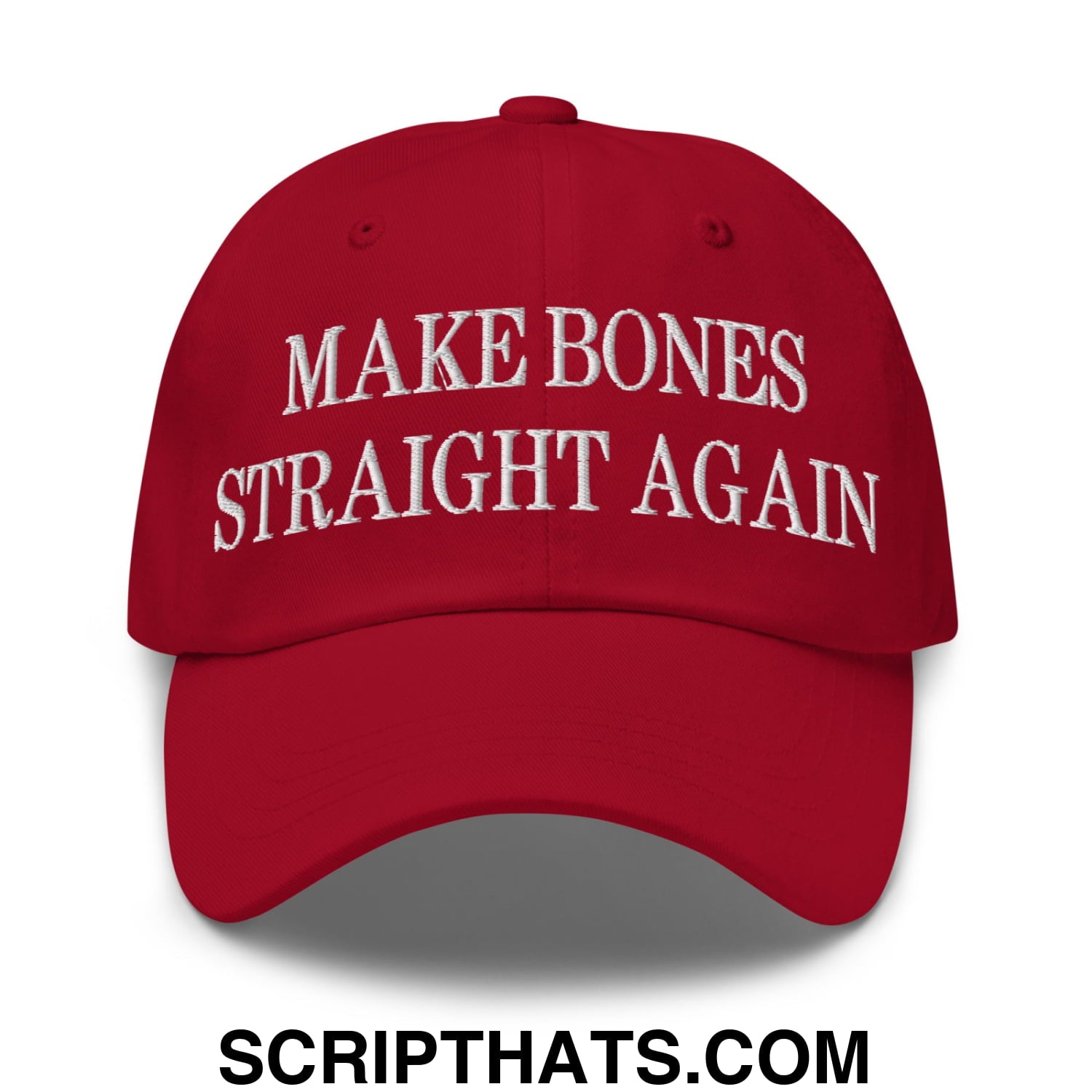 A red embroidered unstructured dad hat with white text reading make bones straight again for casual wear