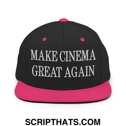 Black snapback cap with vibrant pink flat brim and button, embroidered with white make cinema great again text
