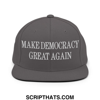 Gray snapback hat with white embroidered make democracy great again text and flat bill brim design