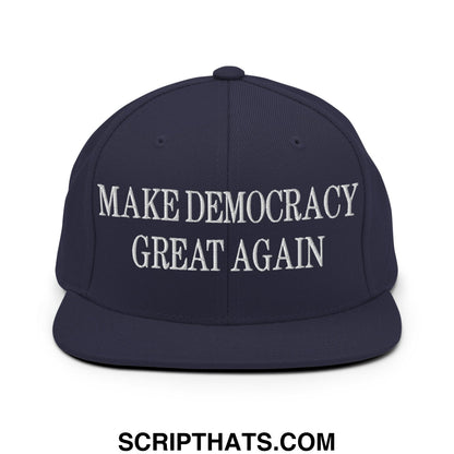 Navy blue snapback hat with white embroidered make democracy great again text and flat bill brim design