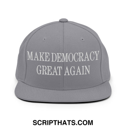 Gray snapback cap with white embroidered make democracy great again text and flat bill brim design