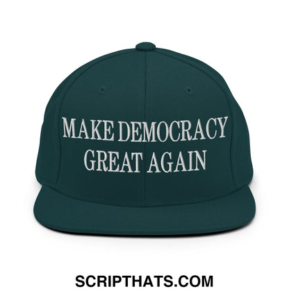 Dark green snapback cap with white embroidered make democracy great again text and flat bill brim design