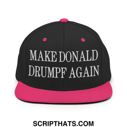 Black snapback cap with vibrant pink brim and button featuring white embroidered make Donald Drumpf again text
